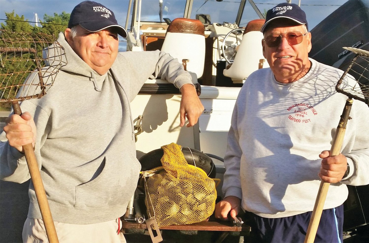 Friends Barry Fuller and Roger Tellier enjoy shellfishing for quahogs on Narragansett Bay, just as they have done for years.